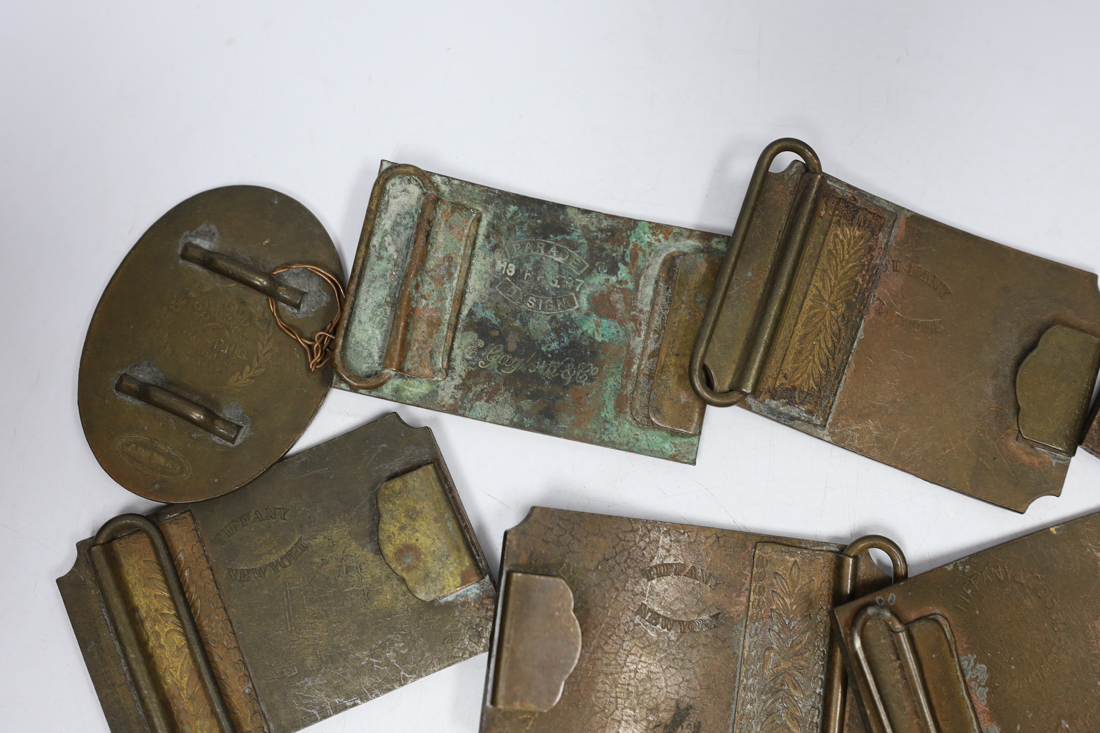 A collection of Wells Fargo and similar belt buckles, mostly by Tiffany & Co.